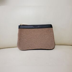 The Sak x Elliot Lucca pouch in brown with chocolate brown leather trim